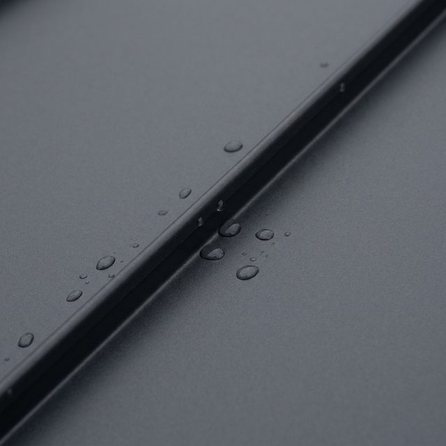 Charcoal 24 gauge standing seam steel panel with a raised seam