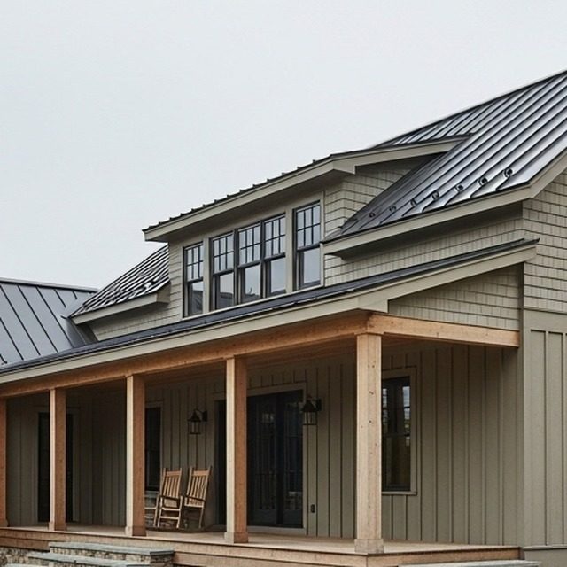 Standing seam metal roof over a dormer and a deep covered porch
